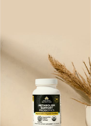 Regenerative Organic Certified® Metabolism Support Probiotics Capsules bottle on a tan background