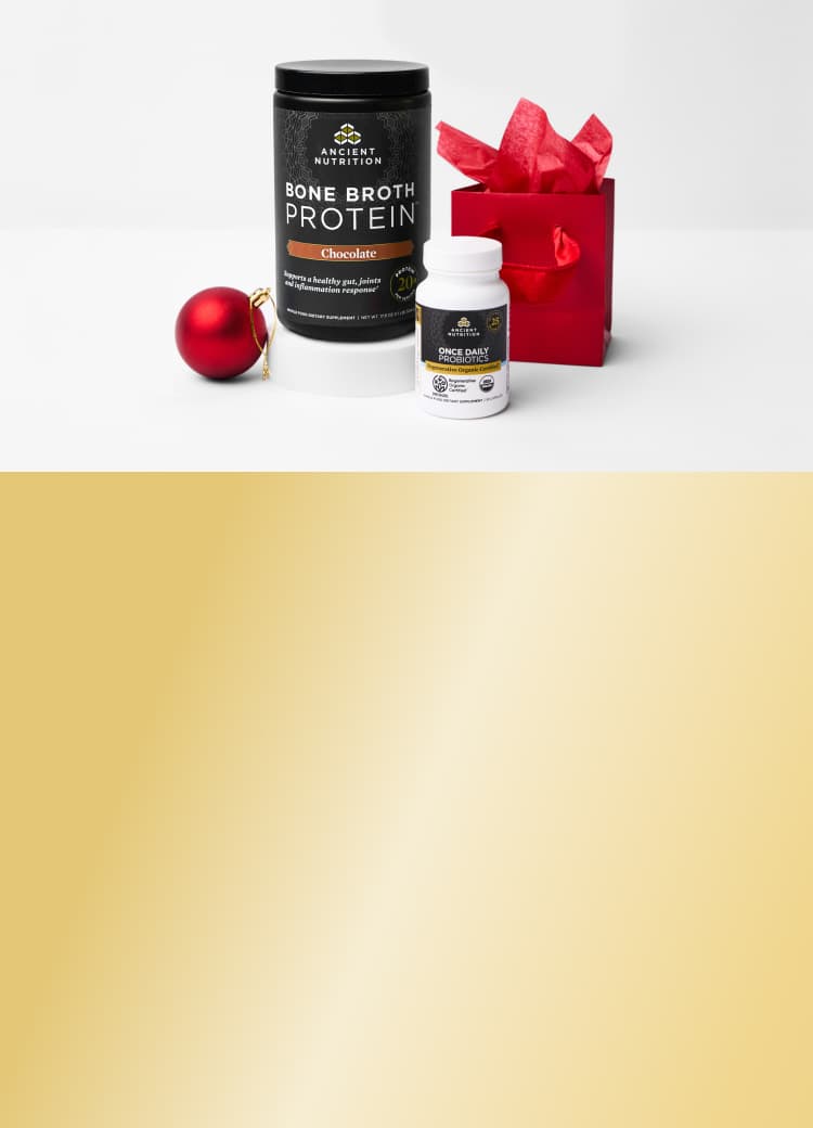 3 bottles of ancient nutrition product with a red holiday box