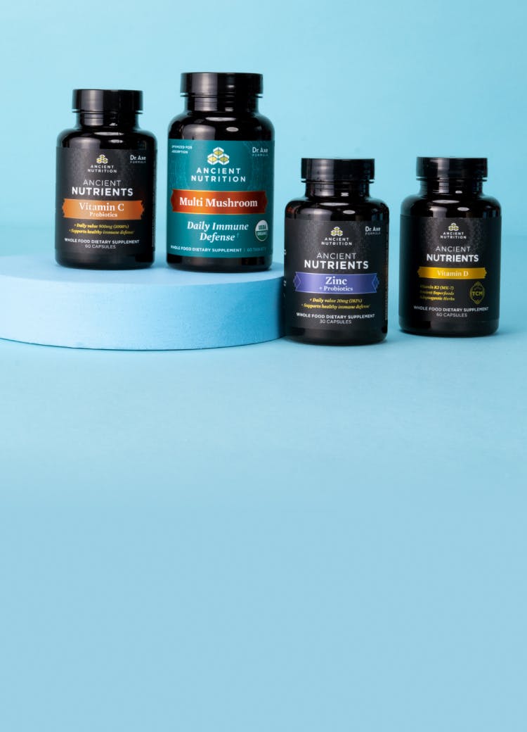 4 immune supplement bottles on a blue background 