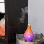 Aromatherapy Essential Oil Diffuser with light on in a house