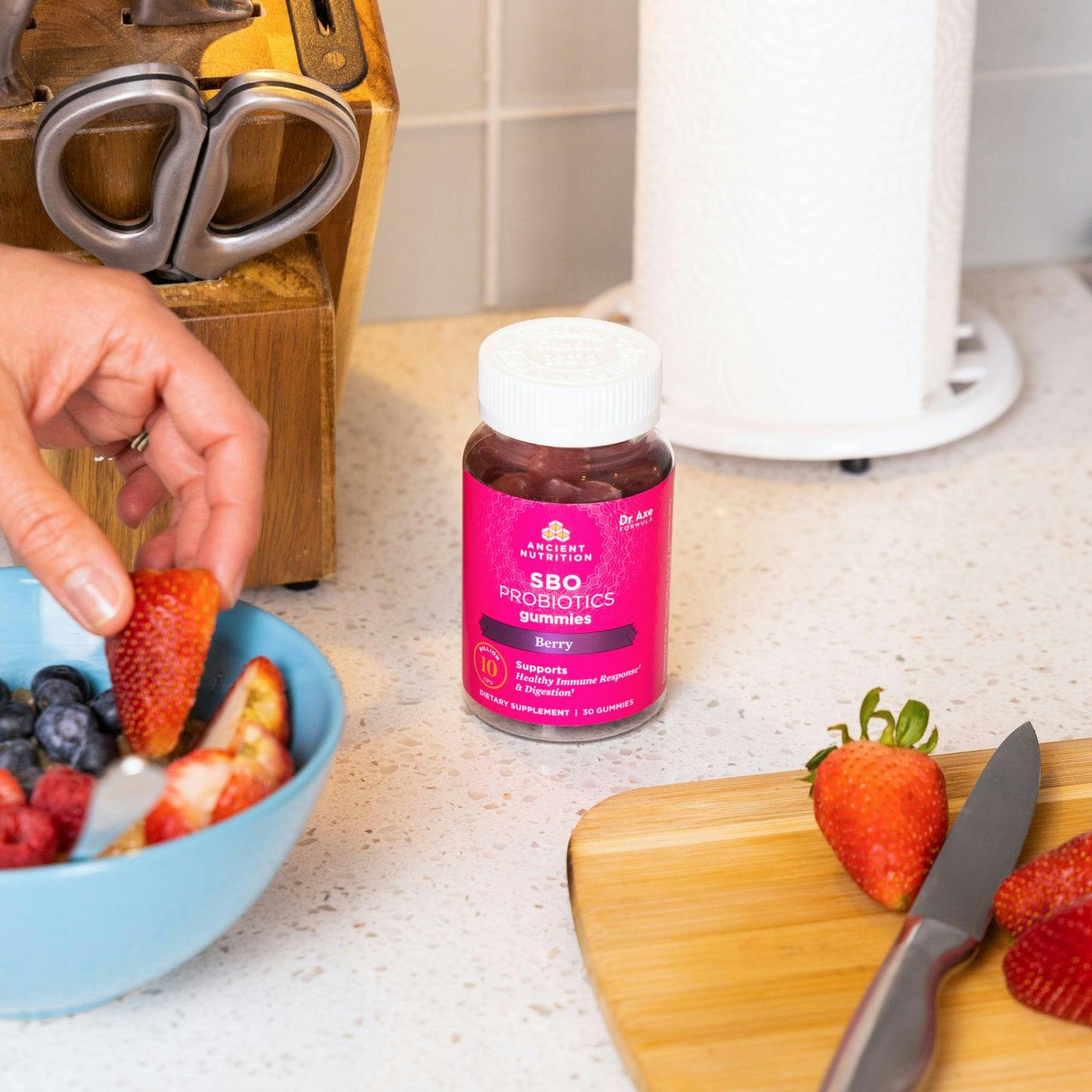 SBO Probiotics Gummies Berry - 30ct next to fruit