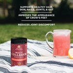 multi collagen protein strawberry lemonade next to drink pitcher in grass