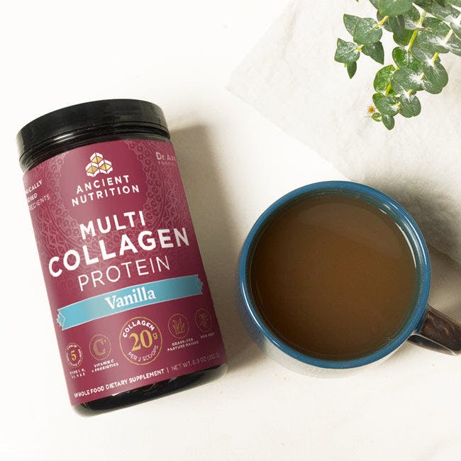 multi collagen protein vanilla next to coffee cup