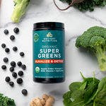 Organic SuperGreens Alkalize & Detox surrounded by fruit and veggies