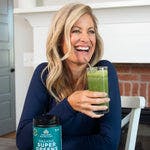 a woman drinking Organic Super Greens + Organic Collagen Powder