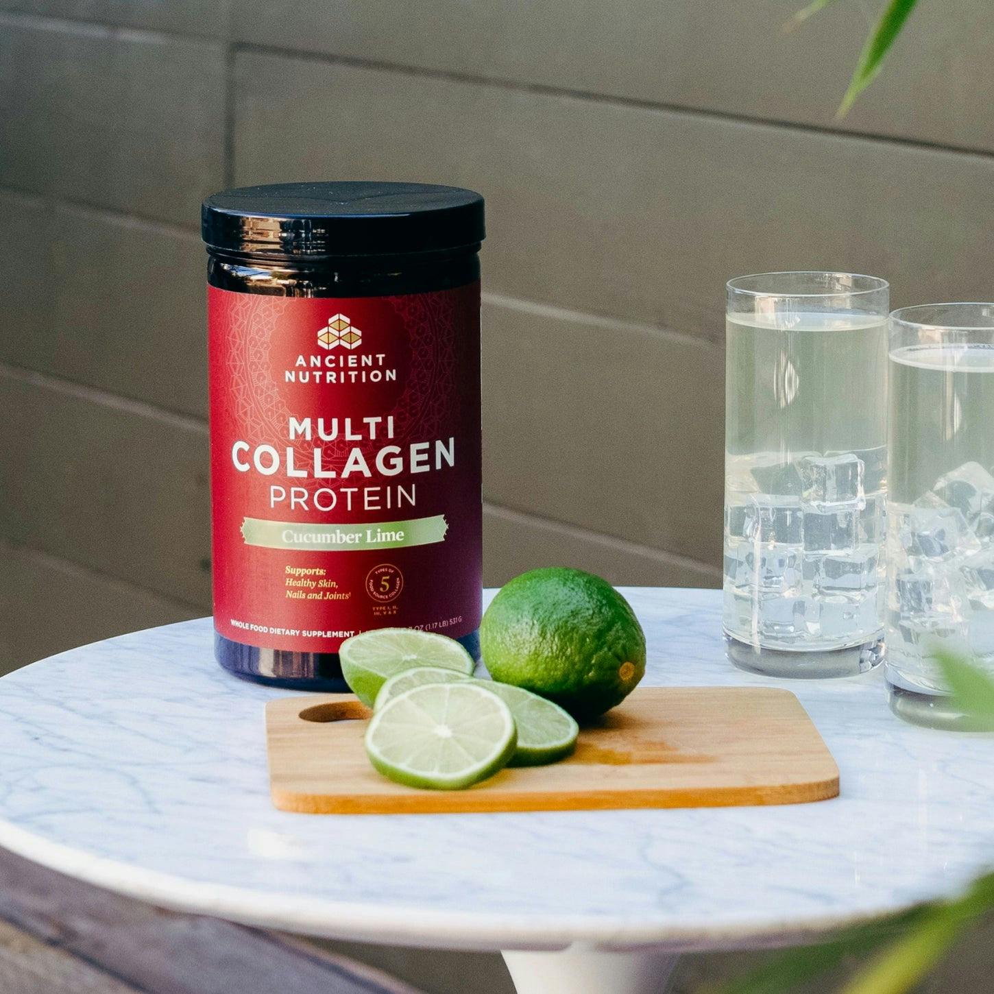 multi collagen protein cucumber lime bottle next to cutting board of limes