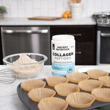 collagen peptides next to a muffin tin