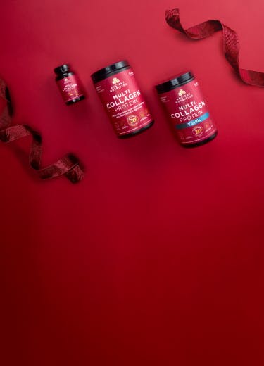 multi collagen protein bottles on a red background with holiday ribbon