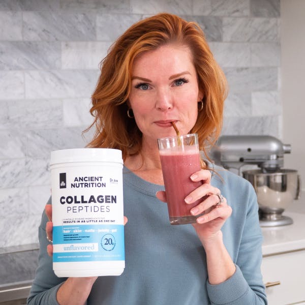 woman drinking collagen peptides smoothie