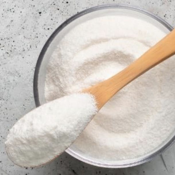 white powder with wooden spoon