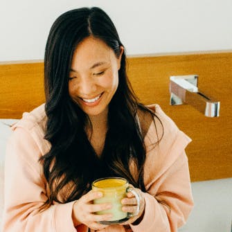 women drinking coffee in bed