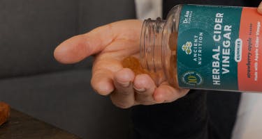 bottle of herbal cider vinegar gummies