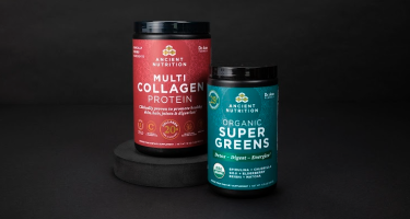 bottle of supergreens and multi collagen protein on a black background