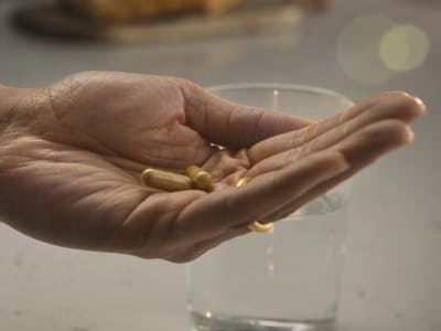 capsules in a person's hand